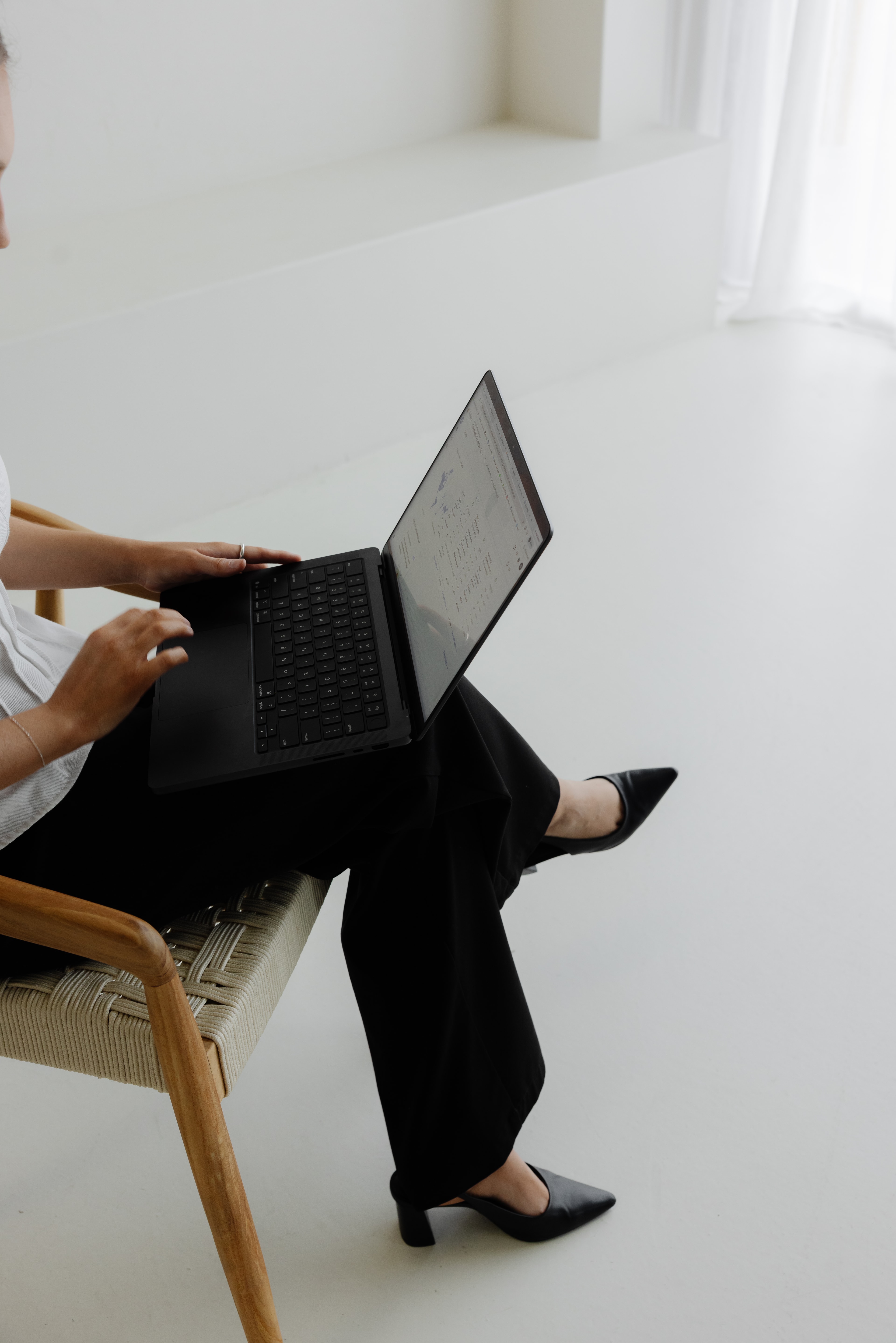 Brink team member sitting down on laptop